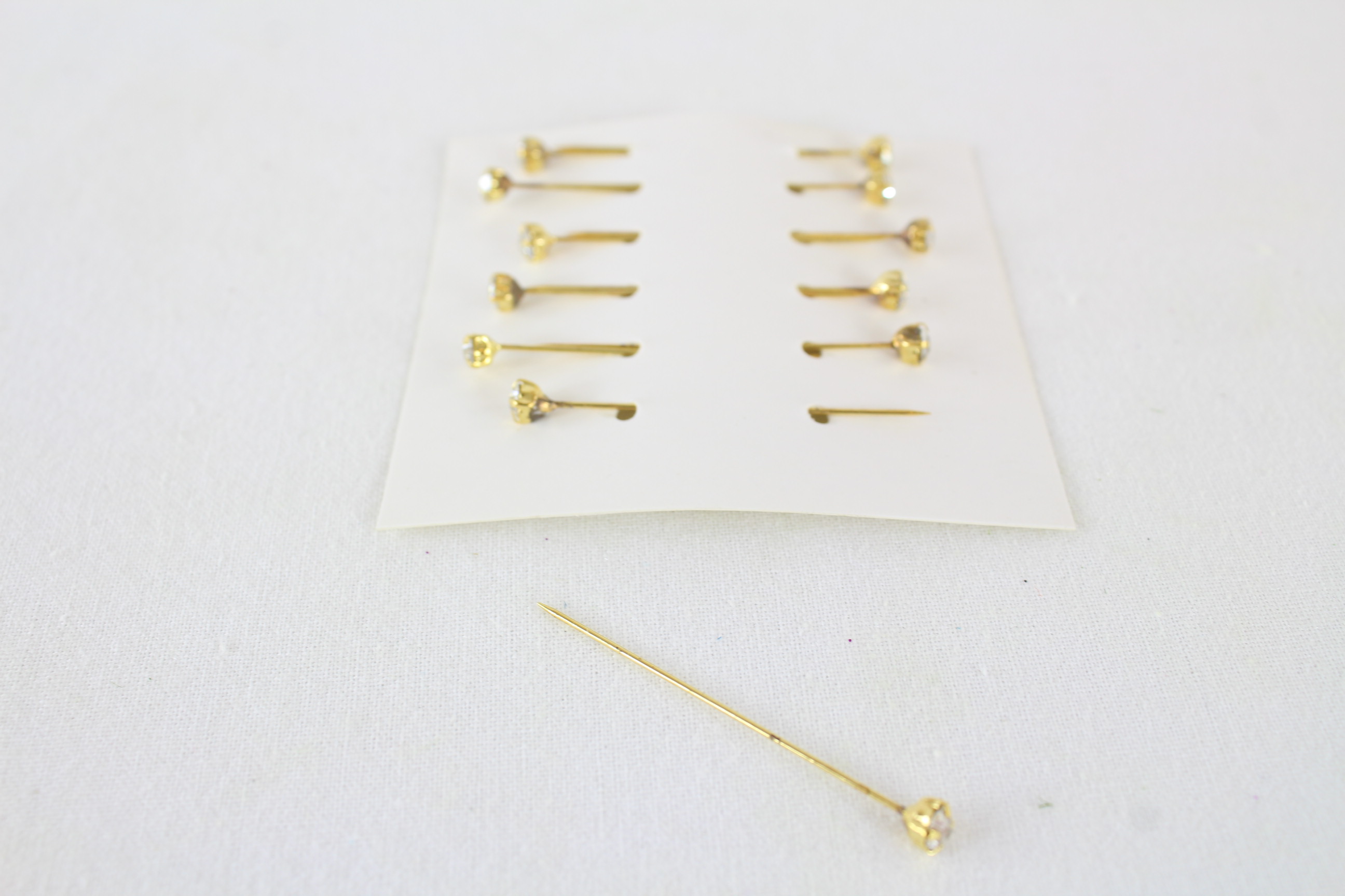 12 Packets of 12 4mm Rhinestone Pins On Card Gold / Clear