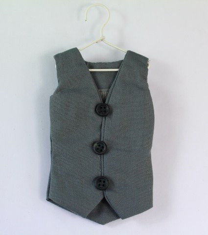 Grey waistcoat on hanger. Small hidden gift bags