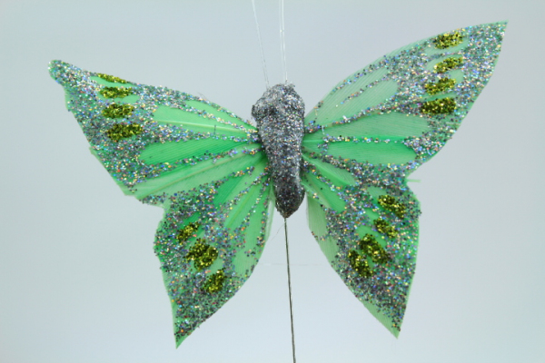 Green craft butterfly for decorating your wedding event.