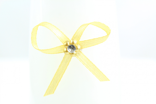 Our small suttle gold bow with adhesive pad