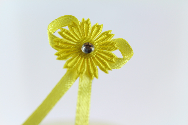 Our bright yellow daisy craft bow with diamonte center